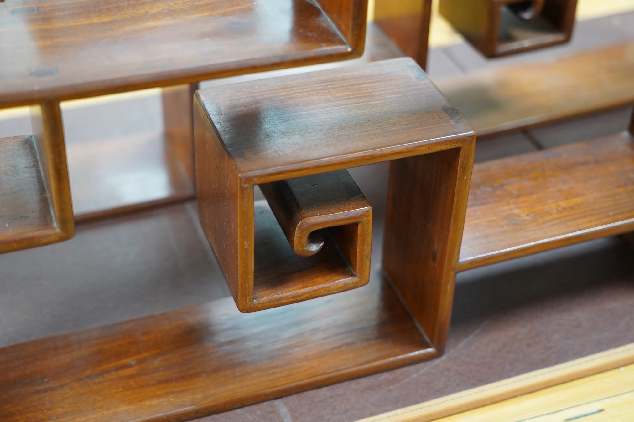 A pair of Chinese padouk wood display shelves, width 80cm, depth 10cm, height 51cm. Condition - fair